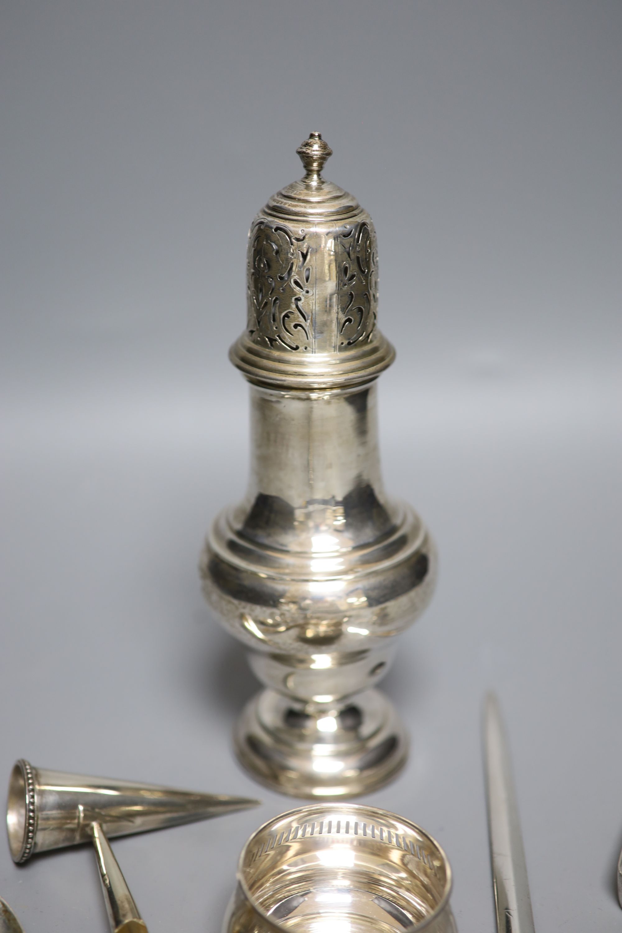 A George III silver meat skewer, Mary & Elizabeth Sumner, London, 1809, a George V silver sugar caster, 21.4cm & other small silver.